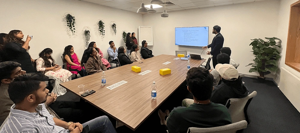 A meeting being held around a conference table at MVR Rivermount Construction